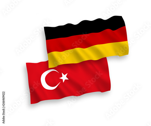 National vector fabric wave flags of Turkey and Germany isolated on white background. 1 to 2 proportion.