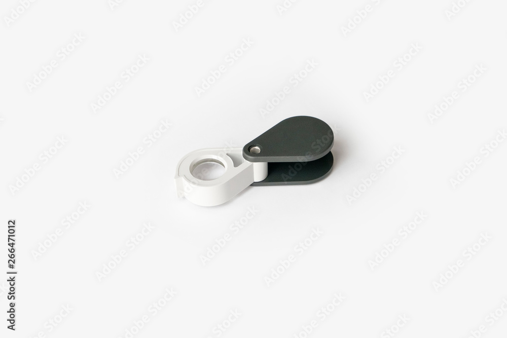 Magnifying glass for diamonds or see the amulet Isolated on a White Background. Magnifying glass for diamonds or see the amulet Isolated on a White Background.