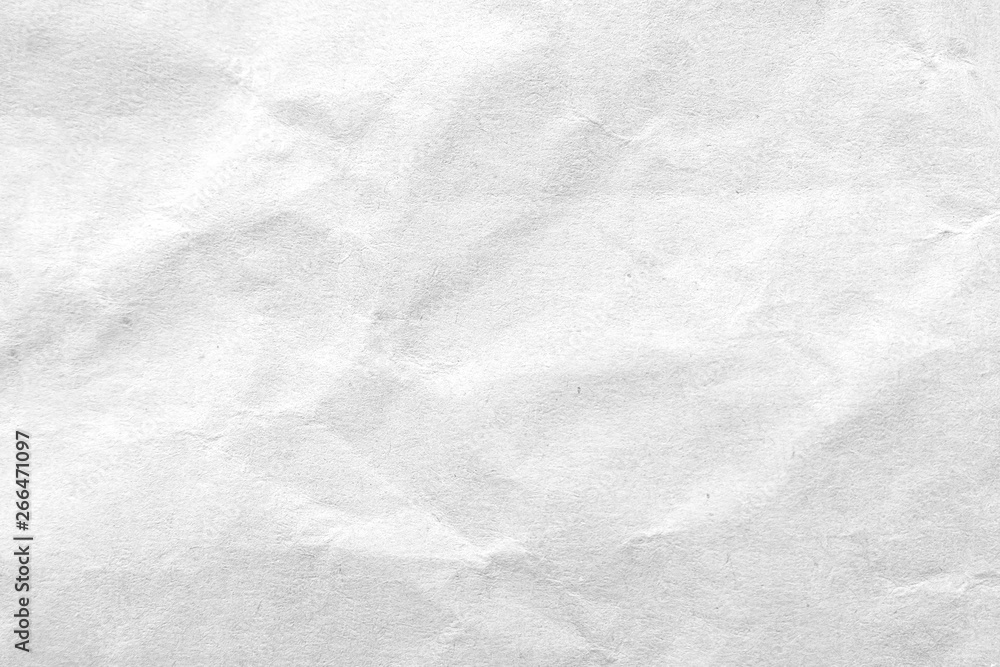Fototapeta premium White crumpled paper texture background. Close-up.