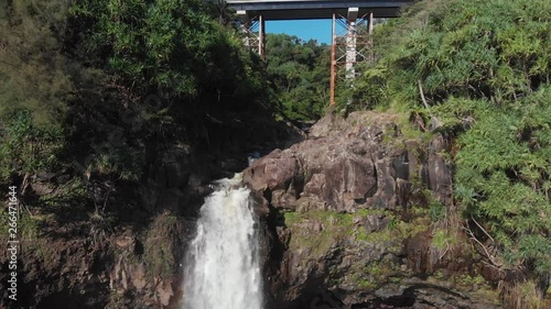 beautiful waterfall near bridge in hilo Hawaii photo