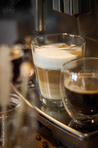 Cappuccino coffee making process in a coffee machine