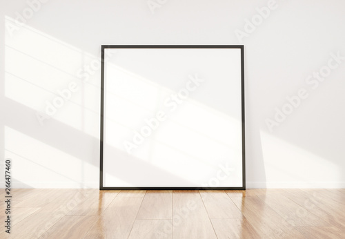 Black frame leaning in bright white interior with wooden floor mockup 3D rendering