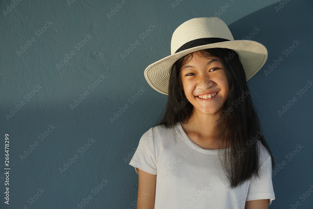 portrait of young woman in hat with summer white blue background portrait of young woman in hat with summer white blue background