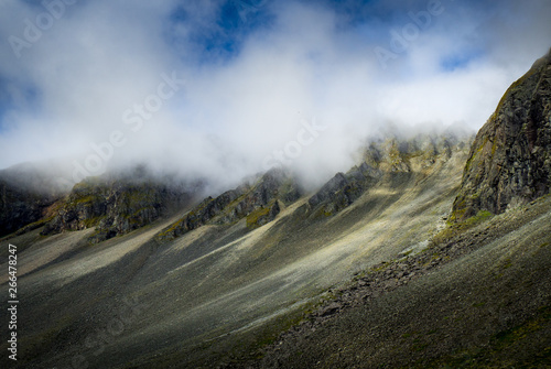 Mountains in the foggy clouds in Iceland