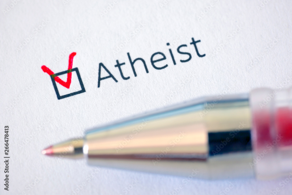 Questionnaire. Red pen and the inscription ATHEIST with check mark on the white paper Questionnaire. Red pen and the inscription ATHEIST with check mark on the white paper