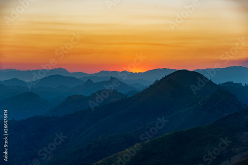 sunset over mountains in laos © Danou