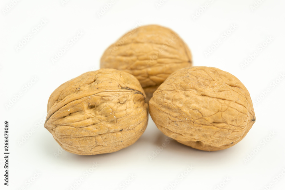 Close-up of fresh walnuts isolated on white background. Healthy nuts with omega 3 fatty acids and antioxidants for beautiful skin and healthy Life. Close-up of fresh walnuts isolated on white background. Healthy nuts with omega 3 fatty acids and antioxidants for beautiful skin and healthy Life.