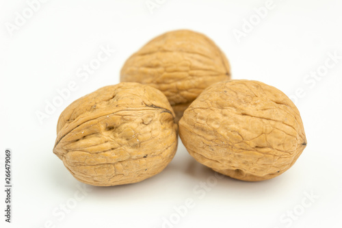 Close-up of fresh walnuts isolated on white background. Healthy nuts with omega 3 fatty acids and antioxidants for beautiful skin and healthy Life.