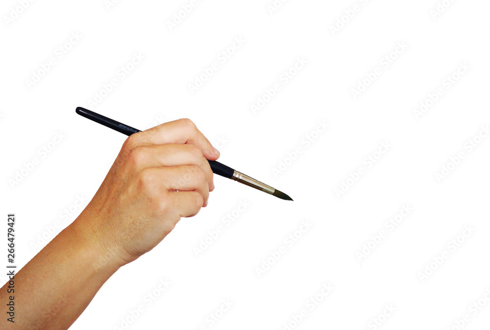 hand holding a brush on white background hand holding a brush on white background