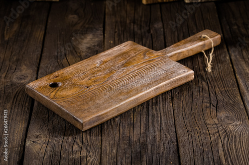 Vászonkép Russia, rustic old vintage wooden cutting board for the kitchen, with a groove s