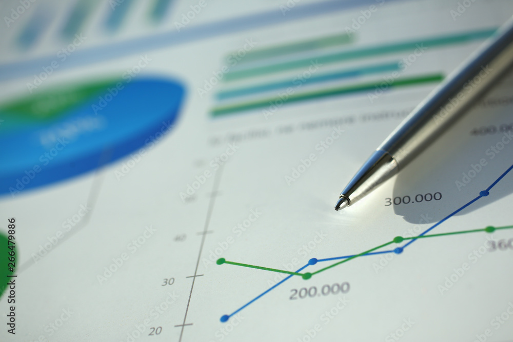Financial statistics documents ball pen infographics at office table closeup. Internal Revenue Service inspector sum check investigation exchange market earnings savings loan and credit concept Financial statistics documents ball pen infographics at office table closeup. Internal Revenue Service inspector sum check investigation exchange market earnings savings loan and credit concept
