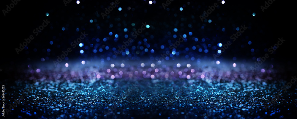 glitter vintage lights background. black silver and blue. de-focused