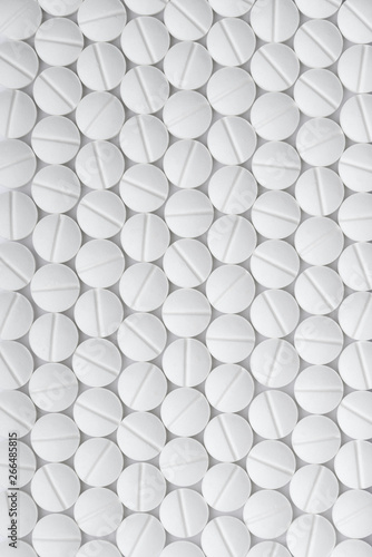 Fototapeta Naklejka Na Ścianę i Meble -  Drugs white tablets pattern abstract background, top view macro