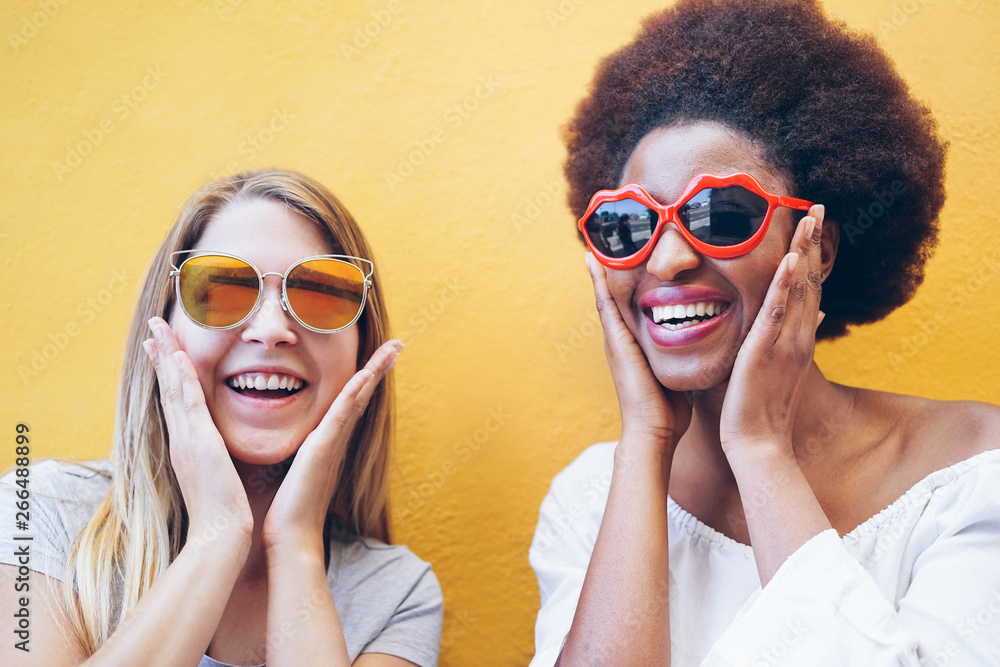 Happy multiracial girls having fun together playing together