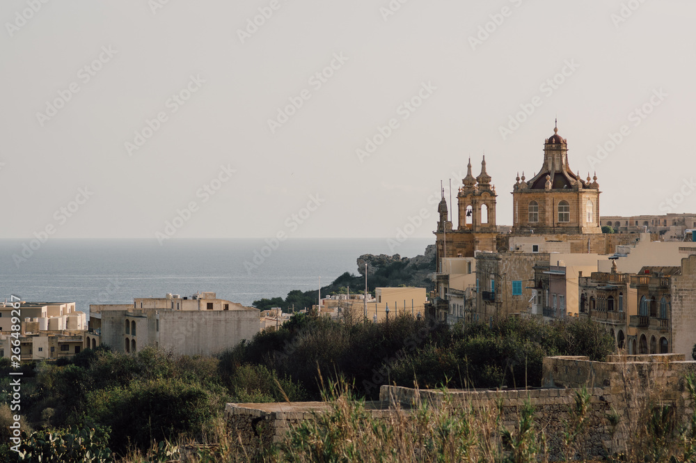 View to church and sea from the hill of Gozo, Malta