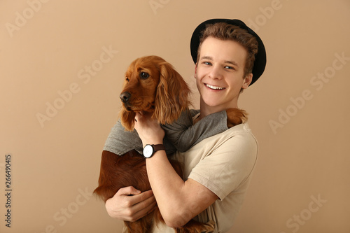 Teenage boy with cute dog o...