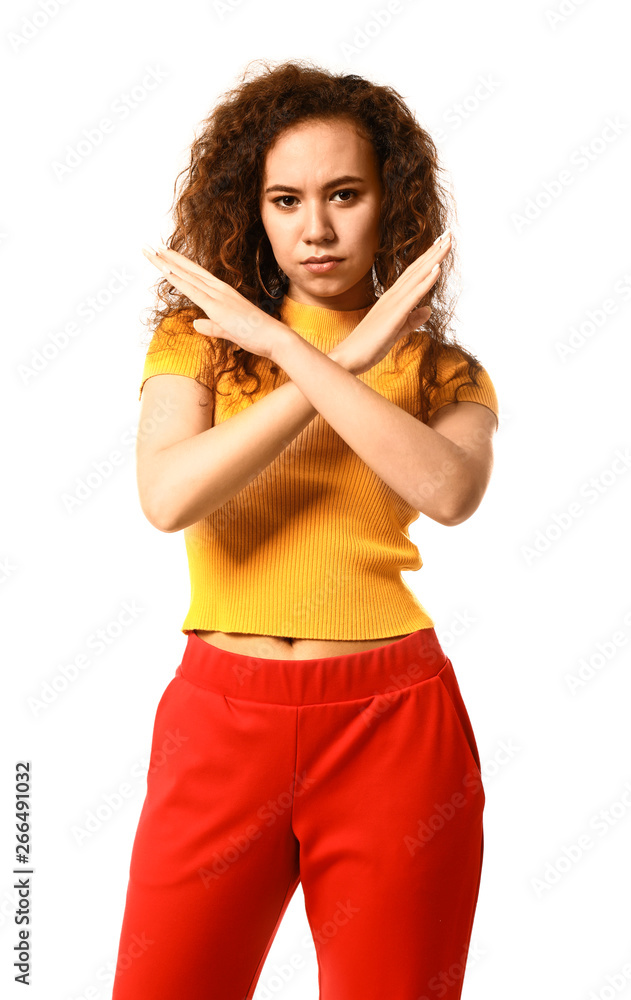 Beautiful young woman showing stop gesture on white background Beautiful young woman showing stop gesture on white background