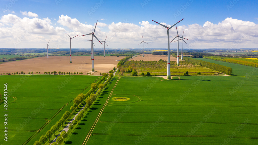 aerial view of landscape with wind turbines in the field aerial view of landscape with wind turbines in the field