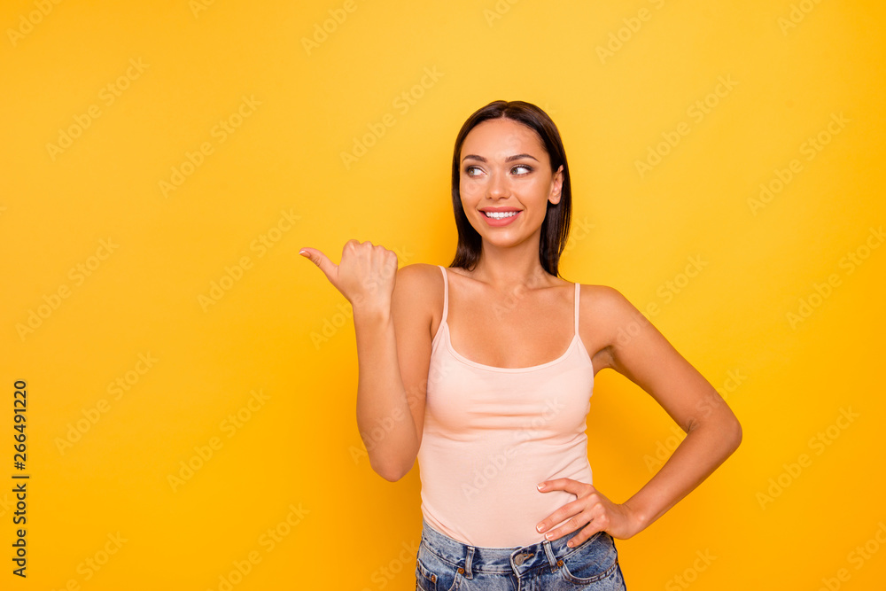Close up photo beautiful amazing she her lady indicate hand arm side empty space wondered black friday low prices wear casual pastel tank-top outfit clothes isolated yellow bright vibrant background Close up photo beautiful amazing she her lady indicate hand arm side empty space wondered black friday low prices wear casual pastel tank-top outfit clothes isolated yellow bright vibrant background