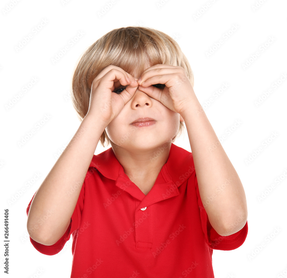 Cute little boy looking through imaginary binocular on white background Cute little boy looking through imaginary binocular on white background