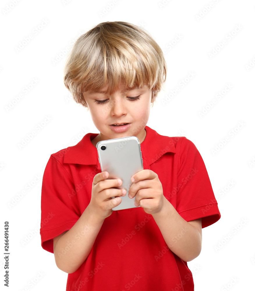 Cute little boy using mobile phone on white background Cute little boy using mobile phone on white background