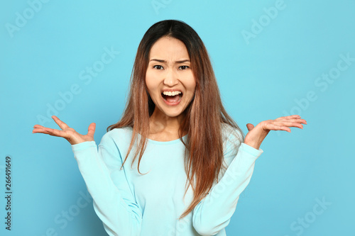 Portrait of angry Asian wom...