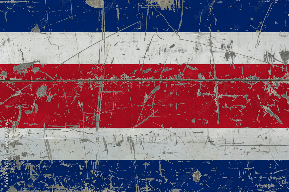Grunge Costa Rica flag on old scratched wooden surface. National vintage background.