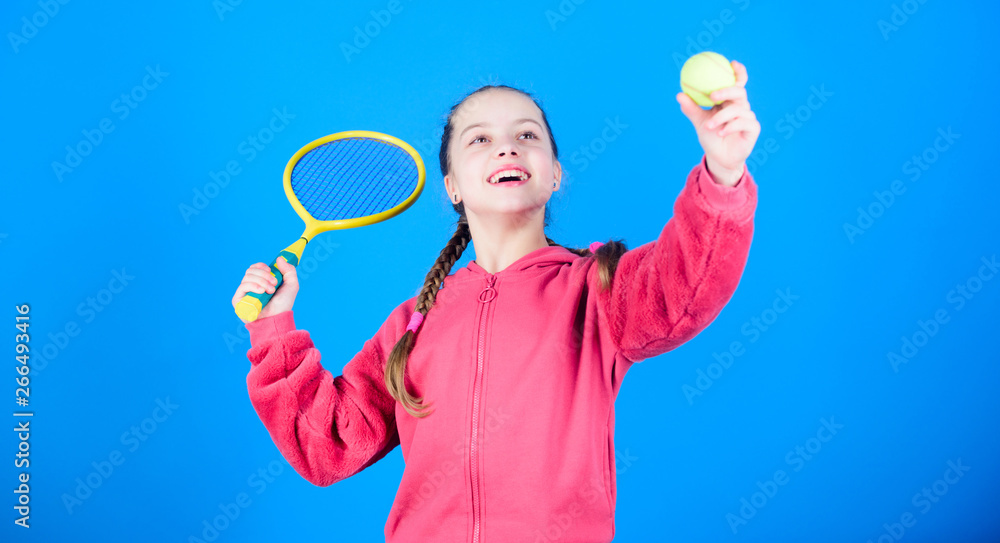 Tennis player with racket and ball. Tennis is fun. Childhood activity. Little girl. Fitness diet brings health and energy. Sport game. Happy child play tennis. Gym workout of teen girl. having fun Tennis player with racket and ball. Tennis is fun. Childhood activity. Little girl. Fitness diet brings health and energy. Sport game. Happy child play tennis. Gym workout of teen girl. having fun