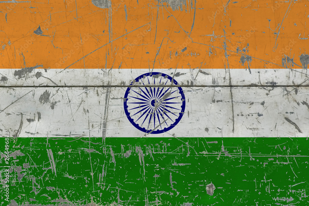 Grunge India flag on old scratched wooden surface. National vintage background.