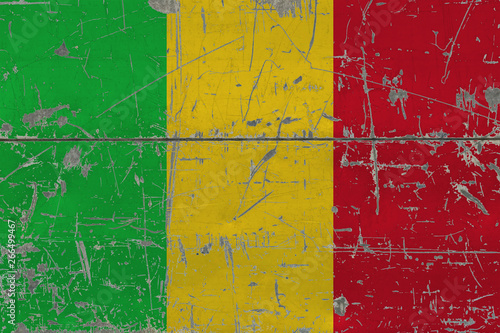 Grunge Mali flag on old scratched wooden surface. National vintage background. © sezerozger