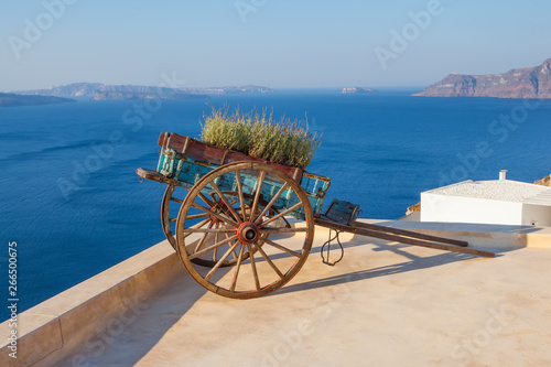Santorini card with retro cart, lavender flowers, sea and sky