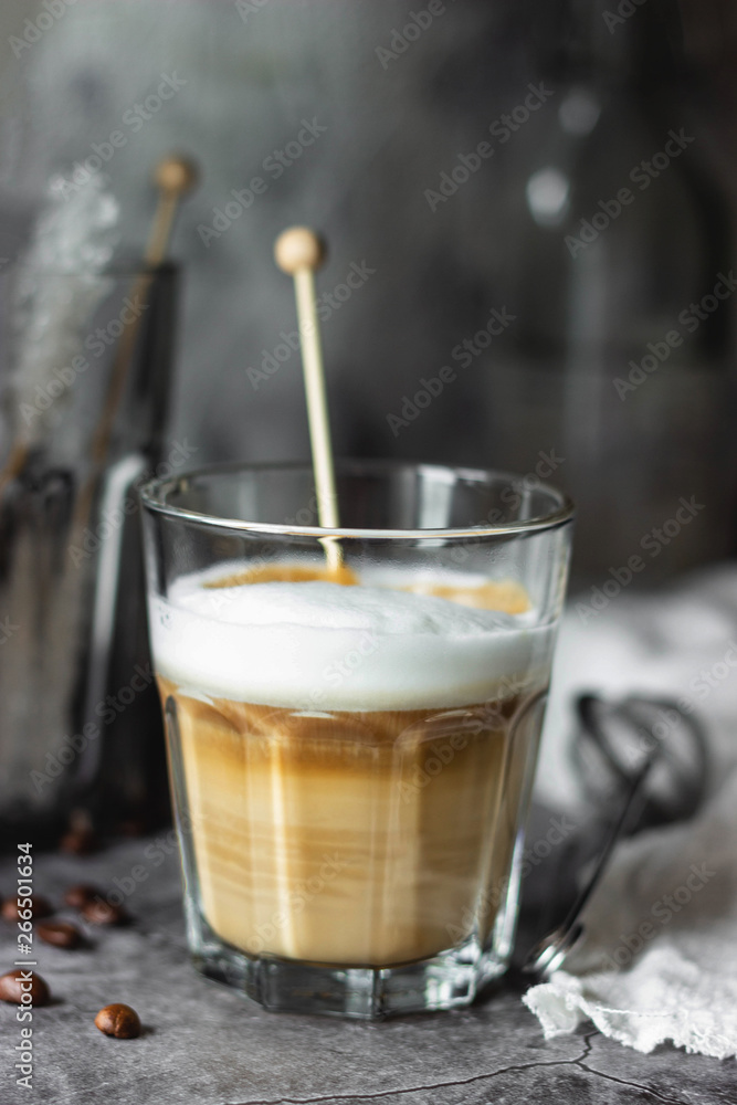 cappuccino coffee in a glass cup on the table cappuccino coffee in a glass cup on the table