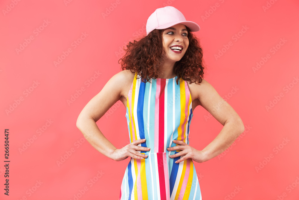 Happy pretty redhead woman wearing in dress and cap posing Happy pretty redhead woman wearing in dress and cap posing