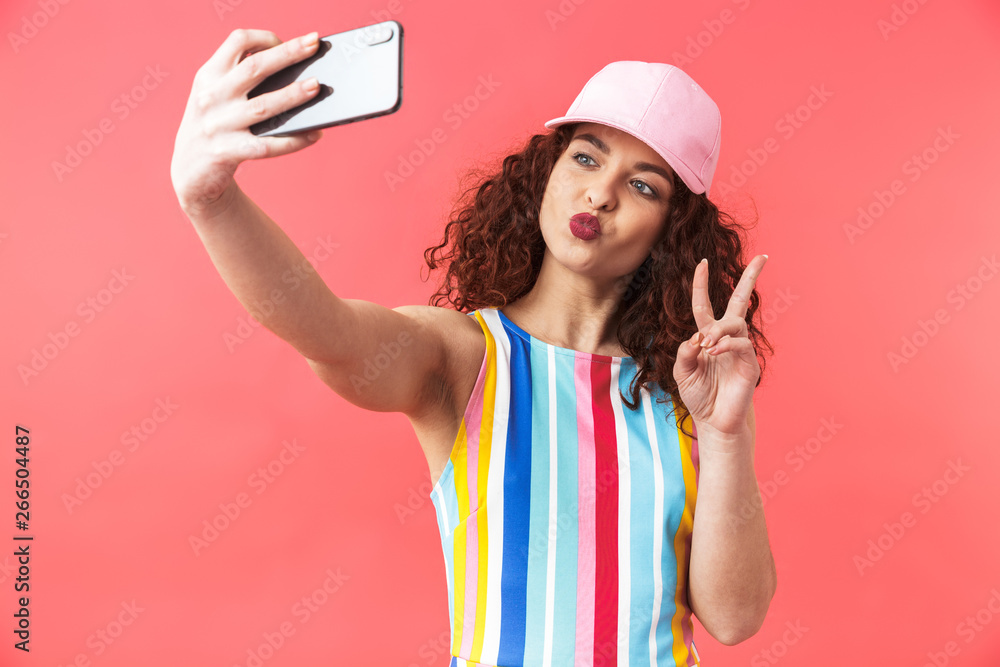 Funny pretty redhead woman wearing in dress and cap Funny pretty redhead woman wearing in dress and cap