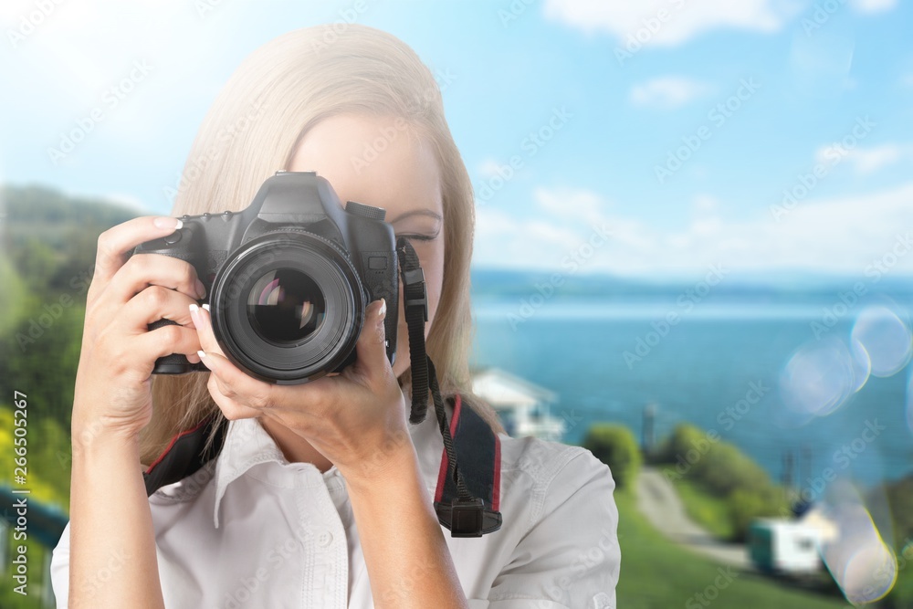 Woman-photographer takes images, isolated
