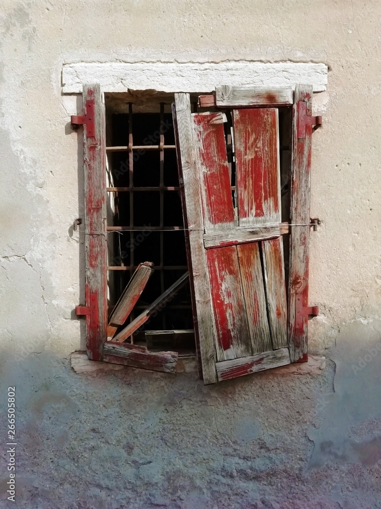 old window with ruin shutters