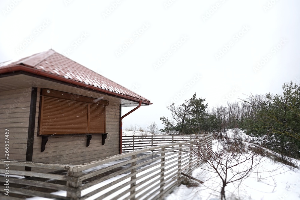 An observation tower on the shore of the Baltic Sea in Lithuania on the Curonian Spit in the winter season An observation tower on the shore of the Baltic Sea in Lithuania on the Curonian Spit in the winter season