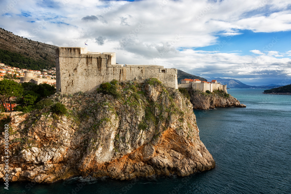 View of the fortress of St. Lawrence and the fortress wall around the Old City in Dubrovnik on a sunny day