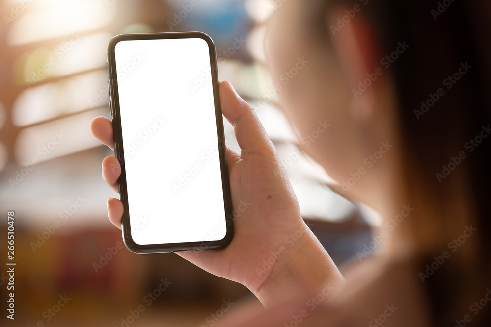 Close up Woman hand Using a Smart Phone at cafe coffee shop with blur background. Close up Woman hand Using a Smart Phone at cafe coffee shop with blur background.
