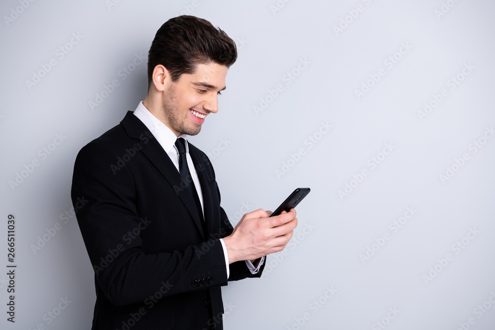 Profile side view photo of smart confident executive investor investment concept have success new contract get messages feel satisfied isolated wear trendy fashionable clothing on grey background Profile side view photo of smart confident executive investor investment concept have success new contract get messages feel satisfied isolated wear trendy fashionable clothing on grey background