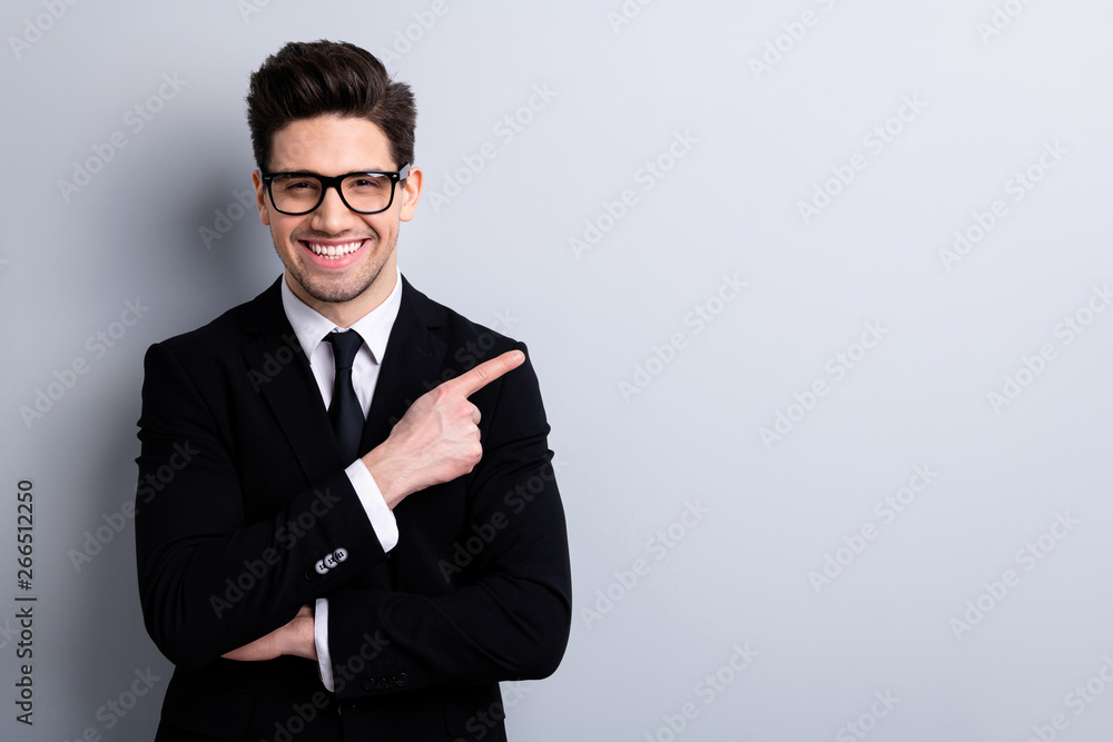Portrait of his he nice imposing representative elegant classy chic attractive cheerful guy sales expert development agent broker pointing aside isolated over light gray background Portrait of his he nice imposing representative elegant classy chic attractive cheerful guy sales expert development agent broker pointing aside isolated over light gray background