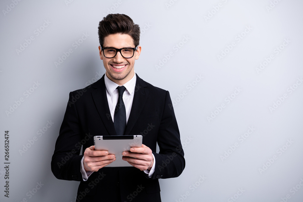 Portrait of his he nice representative elegant classy attractive cheerful guy executive leader expert development agent broker reading new digital e-book isolated over light gray background Portrait of his he nice representative elegant classy attractive cheerful guy executive leader expert development agent broker reading new digital e-book isolated over light gray background