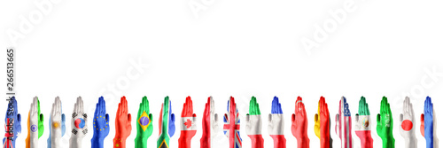 Hands colored in flags of participating countries of The Group of Twenty, major advanced and emerging economies on white background. Collage. International economical relationships. Copy space.