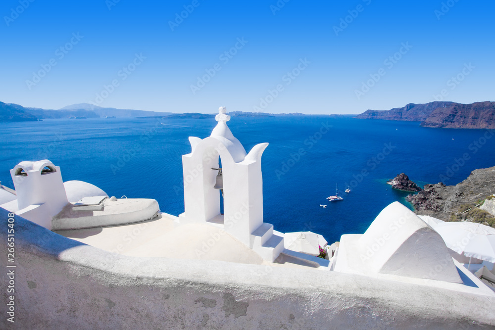 Fototapeta premium Santorini card. White architecture and sky clouds background