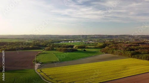 Aerial, panoramic view of farm fields in the vicinity of a city