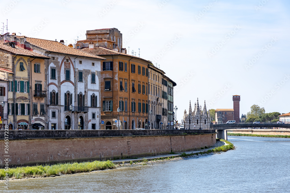 PISA, TUSCANY/ITALY - APRIL 18 : View along the Arno river at Pisa Tuscany Italy on April 18, 2019. Unidentified people PISA, TUSCANY/ITALY - APRIL 18 : View along the Arno river at Pisa Tuscany Italy on April 18, 2019. Unidentified people