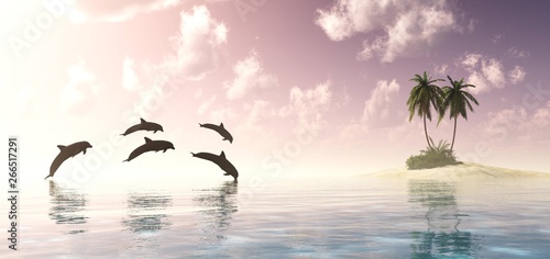 Dolphins playing at sunset near a tropical island with palm trees