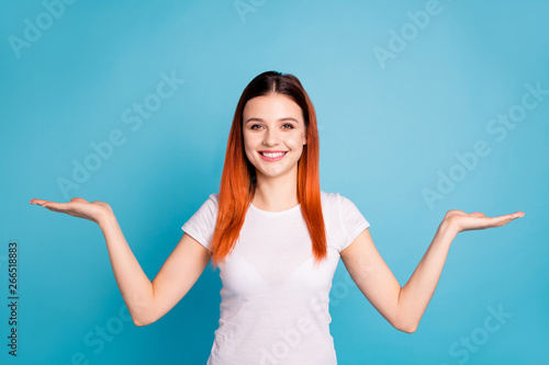 Portrait of cute nice pretty charming lady youngster isolated advise promo choose decide feedback present display notice pick information novelty dressed t-shirt modern blue background