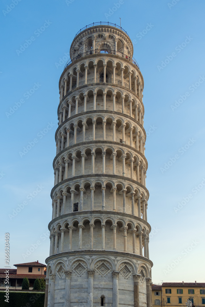 PISA, TUSCANY/ITALY  - APRIL 17 : Exterior view of the Leaning Tower of Pisa Tuscany Italy on April 17, 2019. Three unidentified people