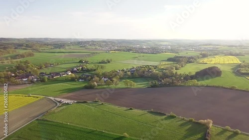Aerial, impressive panoramic view of green fields that extend to the horizon
